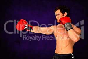 Composite image of muscly man wearing red boxing gloves and punc