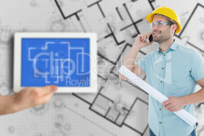 Composite image of male architect with blueprint talking on mobi