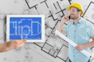 Composite image of male architect with blueprint talking on mobi