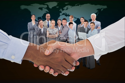 Composite image of close-up shot of a handshake in office