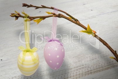 Composite image of hanging easter eggs