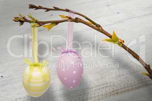 Composite image of hanging easter eggs