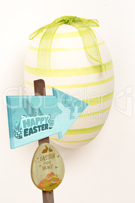 Composite image of easter egg hunt sign