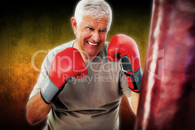 Composite image of portrait of a determined senior boxer