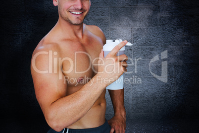 Composite image of bodybuilder holding flask