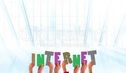 Composite image of hands showing internet