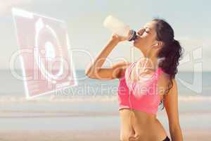Composite image of beautiful healthy woman drinking water on bea