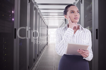 Composite image of confused businesswoman using a tablet pc