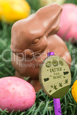 Composite image of easter egg hunt sign