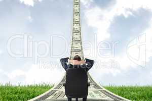 Composite image of businessman sitting in swivel chair