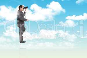 Composite image of businessman standing on ladder