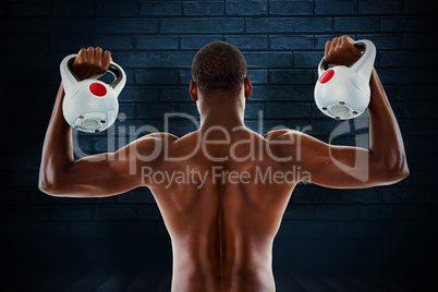 Composite image of rear view of shirtless fit man lifting kettle