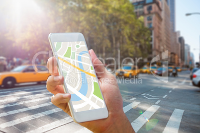 Composite image of man using map app on phone