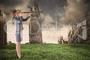 Composite image of businesswoman looking through a telescope