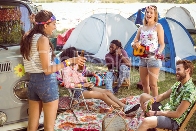 Hipsters having fun in their campsite