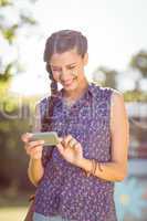 Pretty hipster checking her phone