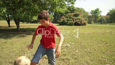 Boy, child, kid playing soccer, football in park, ball