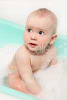 little baby takes a bath