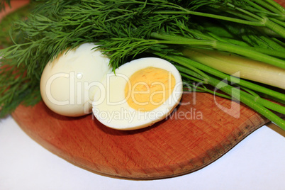 sliced boiled egg, green onions and dill