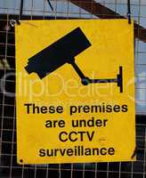 Yellow warning sign for CCTV surveillance