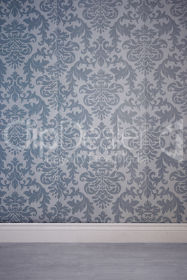Wall covered by wallpaper with floral pattern