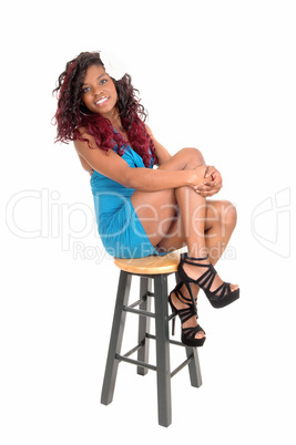 Black woman sitting chair.