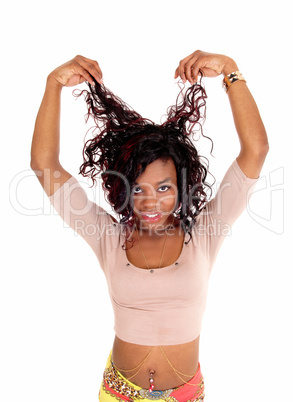 African woman pulling her hair.