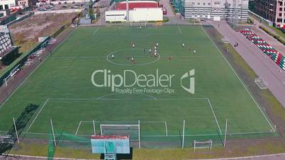 Aerial View of School Team Playing Football, sunny day