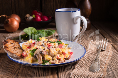 Scrambled eggs with tomatoes and spinach