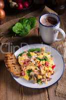 Scrambled eggs with tomatoes and spinach