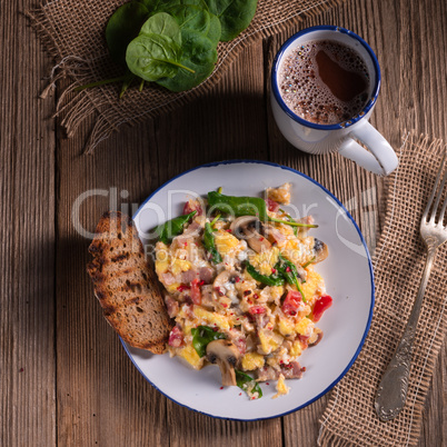 Scrambled eggs with tomatoes and spinach