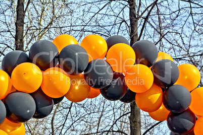 Balloons black and orange with sky