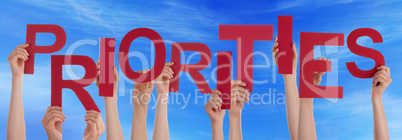 People Hands Holding Red Word Priorities Blue Sky