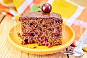 Cake chocolate with cherries and napkin on board
