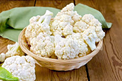 Cauliflower in basket on board