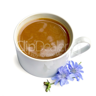 Chicory drink in white cup with blue flower