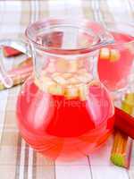 Compote from rhubarb in jar and glassful on tablecloth