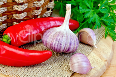 Garlic with spicy red pepper on board