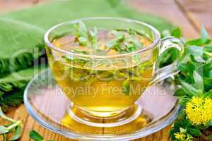 Herbal tea with Rhodiola rosea and napkin on board