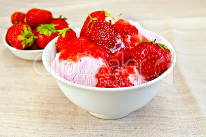 Ice cream strawberry in bowl on fabric