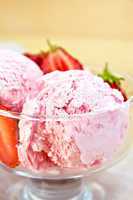 Ice cream strawberry in glass bowl on board