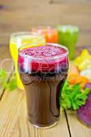 Juice beetroot and vegetable with parsley on board
