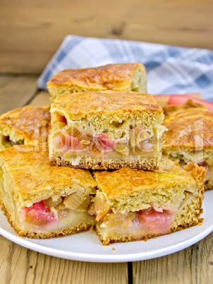 Pie rhubarb in plate and napkin on board