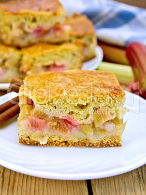 Pie rhubarb in plate on wooden board