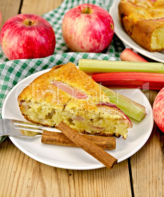 Pie with apple and rhubarb in plate on board