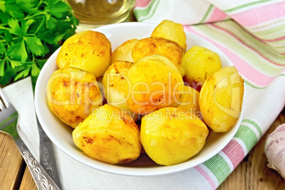 Potatoes fried in plate on fabric
