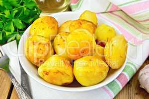 Potatoes fried in plate on fabric