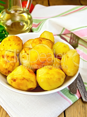 Potatoes fried on plate on table