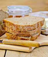 Rye homemade bread with honey and knife on board