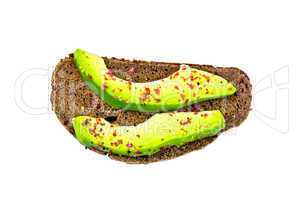 Sandwich with avocado and spices on top